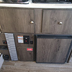 Clipper 1285SST Swing Galley Storage with Refrigerator, 110V outlet and Controls Underneath May Show Optional Features. Features and Options Subject to Change Without Notice.