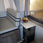 Clipper 1285SST Storage and End Table Between the Dinette and Bunk End May Show Optional Features. Features and Options Subject to Change Without Notice.