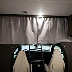 Cab-Over Bunk with Privacy Curtains Closed
 May Show Optional Features. Features and Options Subject to Change Without Notice.