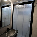 Bathroom with Textured Glass Shower Door
 May Show Optional Features. Features and Options Subject to Change Without Notice.
