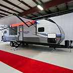 Front 3/4 View with Awning Extended with LED Lights (Shown in Red), Pass-Through Storage Open
 May Show Optional Features. Features and Options Subject to Change Without Notice.