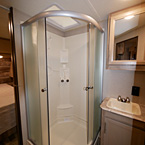 34 Inch by 34 Inch Neo-Angle Shower with Frosted Glass Door, Next to Vanity and Mirrored Medicine Cabinet May Show Optional Features. Features and Options Subject to Change Without Notice.