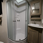 Bathroom - 32 Inch Neo- Angel Glass Shower Door, Next to Mirrored Medicine Cabinet, Vanity Below with Single Bowl Sink and Stainless Steel Faucet 
 May Show Optional Features. Features and Options Subject to Change Without Notice.