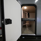 Cargo Storage Door Shown Open with Bunk Down
 May Show Optional Features. Features and Options Subject to Change Without Notice.