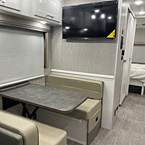 View of Kitchen table, 40" LCD TV Main Coach (29FW, 32LS, 35ES), Solar Privacy Shades Throughout
 May Show Optional Features. Features and Options Subject to Change Without Notice.