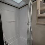 Skylight Above Shower/Tub, Next to Toilet and Mirrored Vanity.
 May Show Optional Features. Features and Options Subject to Change Without Notice.