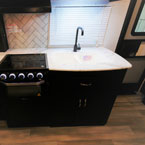 White Double Bowl Sink with Black Faucet.

 May Show Optional Features. Features and Options Subject to Change Without Notice.