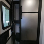 Two Door Pantry Shown Open Next to Stainless Steel Refrigerator.

 May Show Optional Features. Features and Options Subject to Change Without Notice.