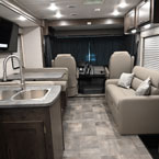 Back to Front - Kitchen, Dinette, Sofa, and Driver's Seat
 May Show Optional Features. Features and Options Subject to Change Without Notice.