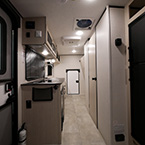 Interior Front to Back - Entrance Door, Kitchen, Refrigerator, Bathroom Door Shown Closed, and Rear Door Shown Closed May Show Optional Features. Features and Options Subject to Change Without Notice.