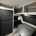 Front of the Unit Showing Refrigerator, Dinette, and Overhead Storage Space May Show Optional Features. Features and Options Subject to Change Without Notice.