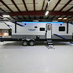 Door Side with Camp Kitchen and Pass through Storage Open, Solid Steps Extended, Awning LED Lights On Shown in Blue.
 May Show Optional Features. Features and Options Subject to Change Without Notice.