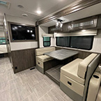 Interior dinette with 50" LCD TV and partial view of bedroom  May Show Optional Features. Features and Options Subject to Change Without Notice.
