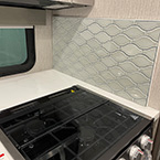 Interior view of tile backsplash and 3-Burner Range with Glass cover May Show Optional Features. Features and Options Subject to Change Without Notice.