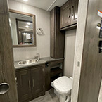 bathroom view of Lavatory Sink, Toilet with Foot Flush and cabinets and linen May Show Optional Features. Features and Options Subject to Change Without Notice.