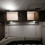 Two Cabinet Doors Above J-Lounge Shown Open with Lights on. 
 May Show Optional Features. Features and Options Subject to Change Without Notice.