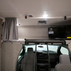 Cab Bunk with Swivel TV and Privacy Curtains.
 May Show Optional Features. Features and Options Subject to Change Without Notice.