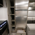 Two Door Pantry Shown Open, Showing Five Shelves. Drawer Below Stainless Steel Refrigerator Shown Open.
 May Show Optional Features. Features and Options Subject to Change Without Notice.