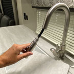 Stainless Steel Pull Down Faucet Shown Extended.
 May Show Optional Features. Features and Options Subject to Change Without Notice.
