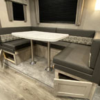 U-Shaped Dinette with Two Doors Below Shown Open.
 May Show Optional Features. Features and Options Subject to Change Without Notice.