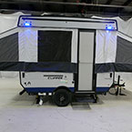 Door Side with Tents and Steps Shown Extended. Blue LED Lights Shown On.
 May Show Optional Features. Features and Options Subject to Change Without Notice.