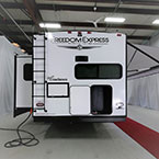 Rear View with Slide Out and Awning Shown Extended. Rear Storage Compartment Shown Open.
 May Show Optional Features. Features and Options Subject to Change Without Notice.