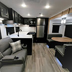 Interior Front to Back; Optional Theater Seats, Rear Kitchen Galley Area, Booth Dinette, Part of Entertainment Center Shown.
 May Show Optional Features. Features and Options Subject to Change Without Notice.