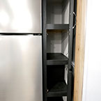 Two Cabinet Doors Next to Refrigerator Shown Open to Show Four Shelves.
 May Show Optional Features. Features and Options Subject to Change Without Notice.