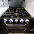 Glass Cover Shown Open to Show Three Burner Cook Top with White LED Knobs.
 May Show Optional Features. Features and Options Subject to Change Without Notice.