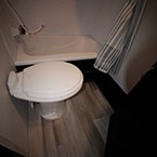 White Foot Flush Toilet.
 May Show Optional Features. Features and Options Subject to Change Without Notice.