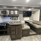 full view of kitchen and dinette with with storage and tv above
 May Show Optional Features. Features and Options Subject to Change Without Notice.